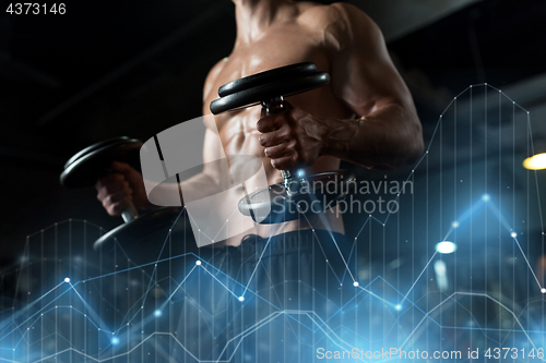 Image of close up of man with dumbbells exercising in gym