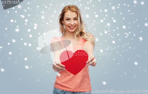 Image of happy woman or teen girl with red heart shape