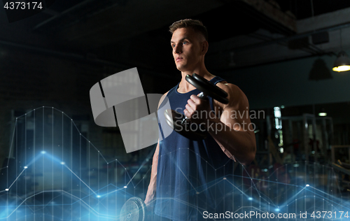 Image of young man with dumbbells exercising in gym