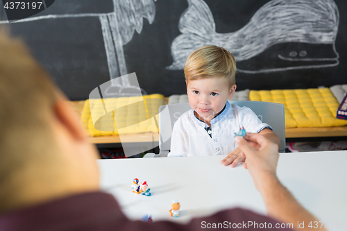 Image of Cute little toddler boy at child therapy session.