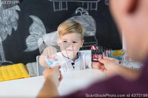 Image of Cute little toddler boy at child therapy session.