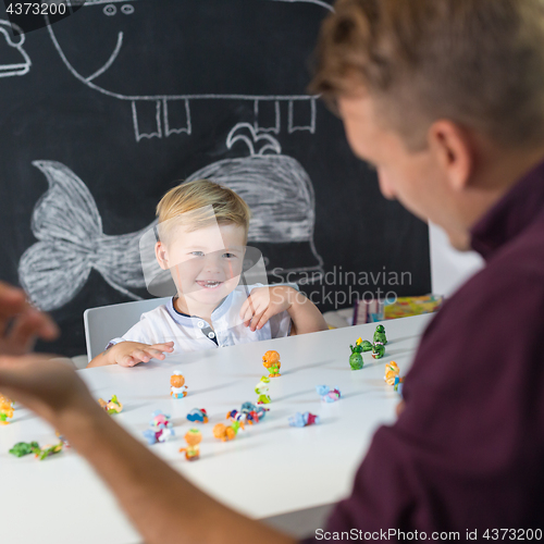 Image of Cute little toddler boy at child therapy session.