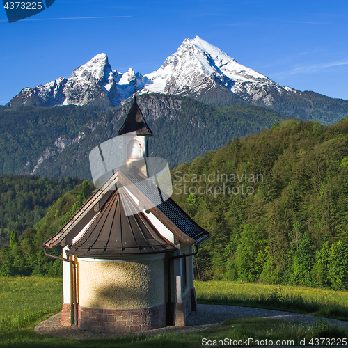 Image of Small chapel Kirchleitn and snow-capped summits of Watzmann moun