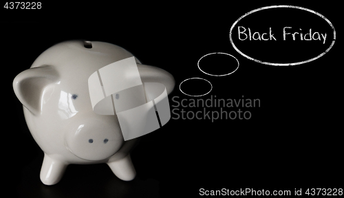 Image of Piggy bank with thought bubbles, thinking BLACK FRIDAY
