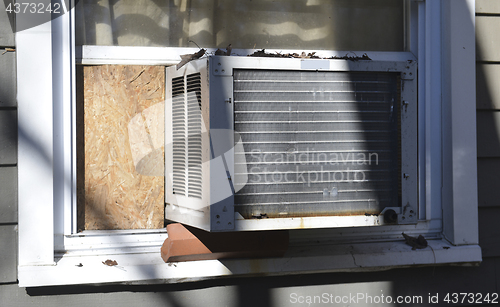 Image of window air conditioner at suburban house