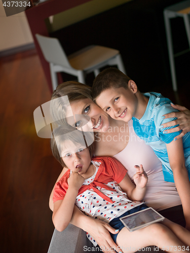 Image of Young Family Using A Tablet To Make Future Plans