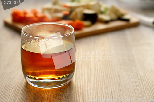 Image of Tea in a glass on a wooden table