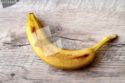 Image of Banana on a wooden table.