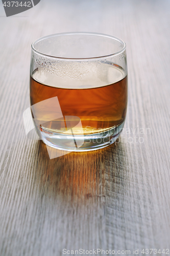 Image of Tea in a glass on a wooden table