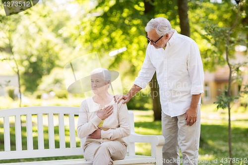 Image of senior woman feeling sick at summer park