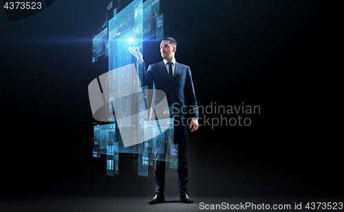 Image of businessman in suit with virtual projection