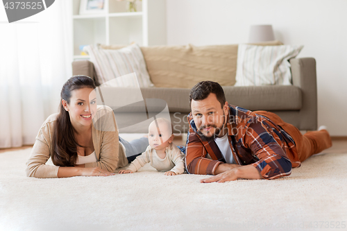 Image of happy family with baby at home