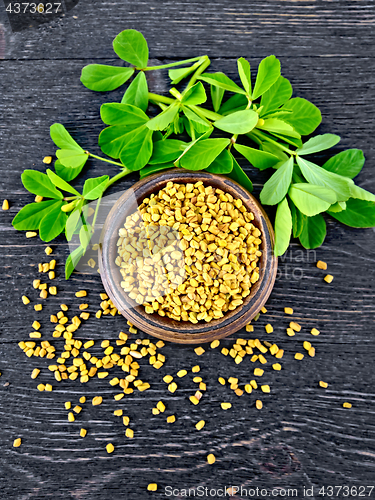 Image of Fenugreek with leaf in bowl on black board top