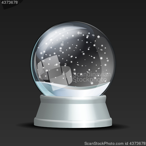 Image of Snow globe with falling snowflakes.