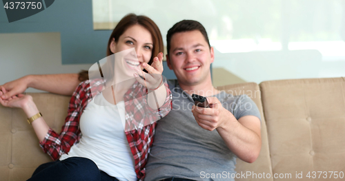 Image of Young Couple Watching Tv at villa