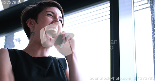 Image of Business Girl Standing In A Modern Building Near The Window With