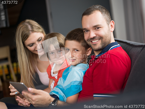 Image of young cuple spending time with kids
