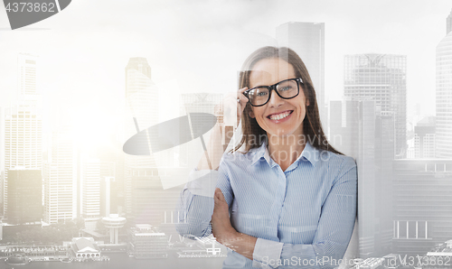 Image of happy smiling middle aged woman in glasses
