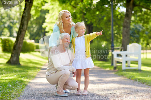 Image of happy mother, daughter and grandmother at park