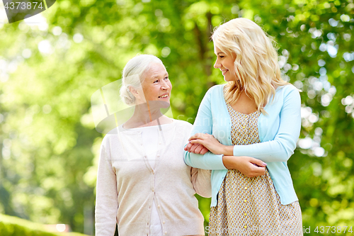 Image of daughter with senior mother at park