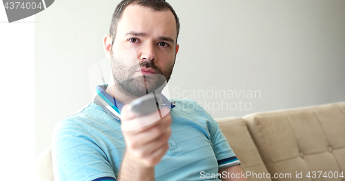 Image of Happy Man Watching Television