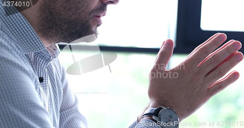 Image of young businessman in startup office