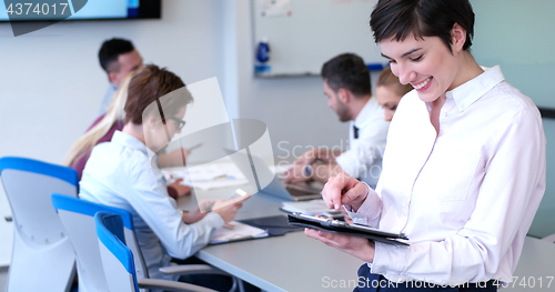 Image of Portrait of  smiling casual businesswoman using tablet  with cow