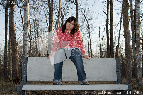 Image of Girl Sitting on a Bench