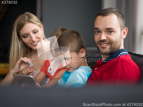 Image of young cuple spending time with kids