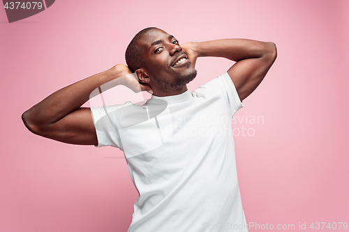 Image of Positive thinking African-American man on pink background