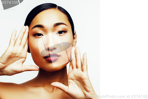 Image of young pretty brunette asian woman emotional posing, happy smiling isolated on white background, lifestyle people concept