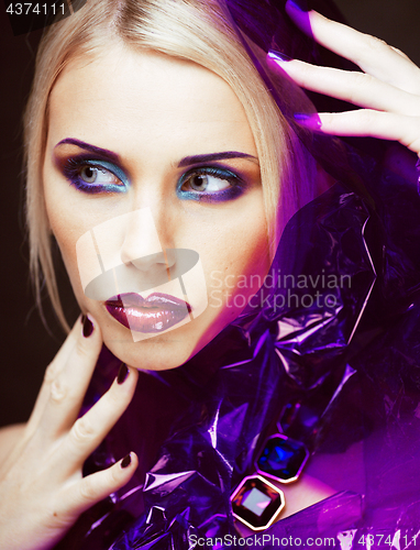 Image of beauty woman with creative make up, many fingers on face