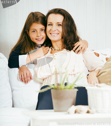 Image of happy mother with daughter at home
