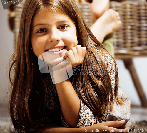 Image of little cute girl at home smiling