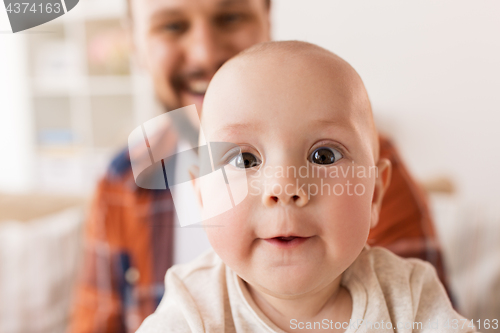 Image of close up of happy little baby boy with father