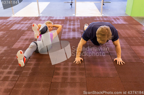 Image of couple exercising in gym