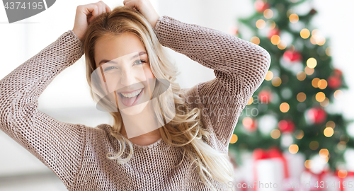 Image of happy young woman or teenage girl at christmas