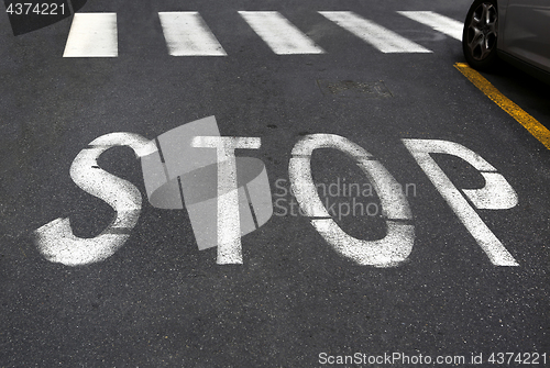 Image of City crosswalk with symbol stop