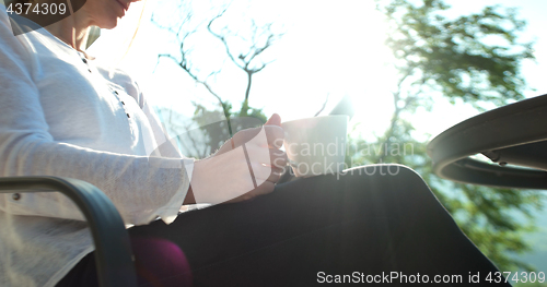 Image of Happy Couple Drinking Coffee and eating breakfast on terrace of 