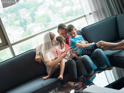 Image of young cuple spending time with kids