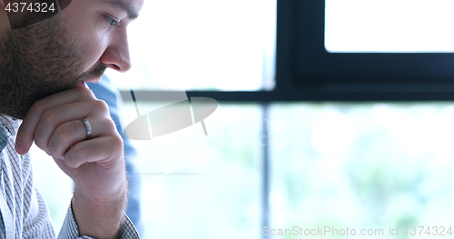 Image of young businessman in startup office