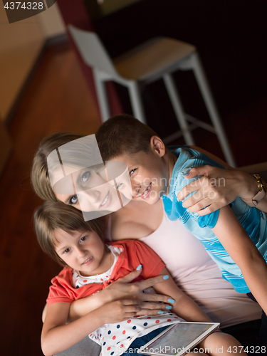 Image of Young Family Using A Tablet To Make Future Plans