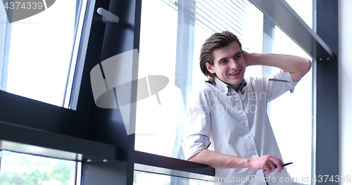 Image of young businessman in startup office