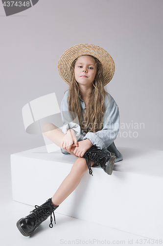 Image of Stylish young teen girl over gray background