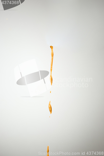 Image of Cooking oil splash on gray background