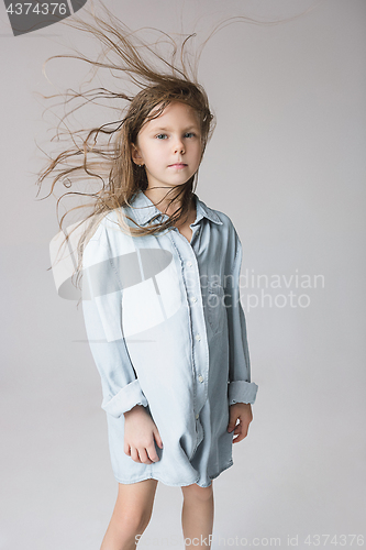 Image of Stylish young teen girl over gray background