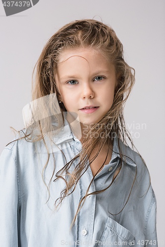 Image of Stylish young teen girl over gray background