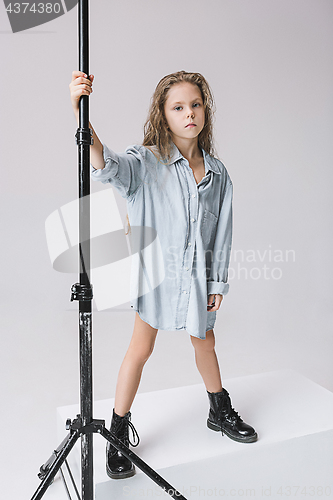 Image of Stylish young teen girl over gray background