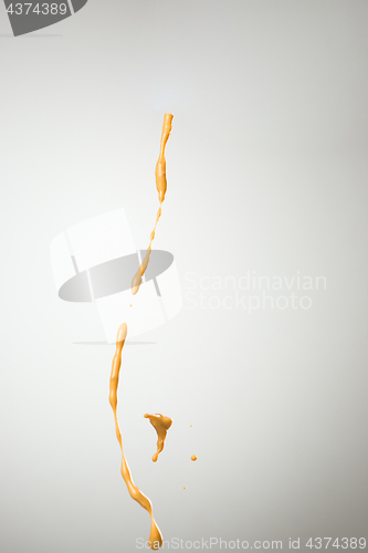 Image of Cooking oil splash on gray background