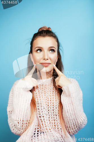 Image of young pretty woman cheerful happy smiling, posing on blue background, lifestyle people concept 